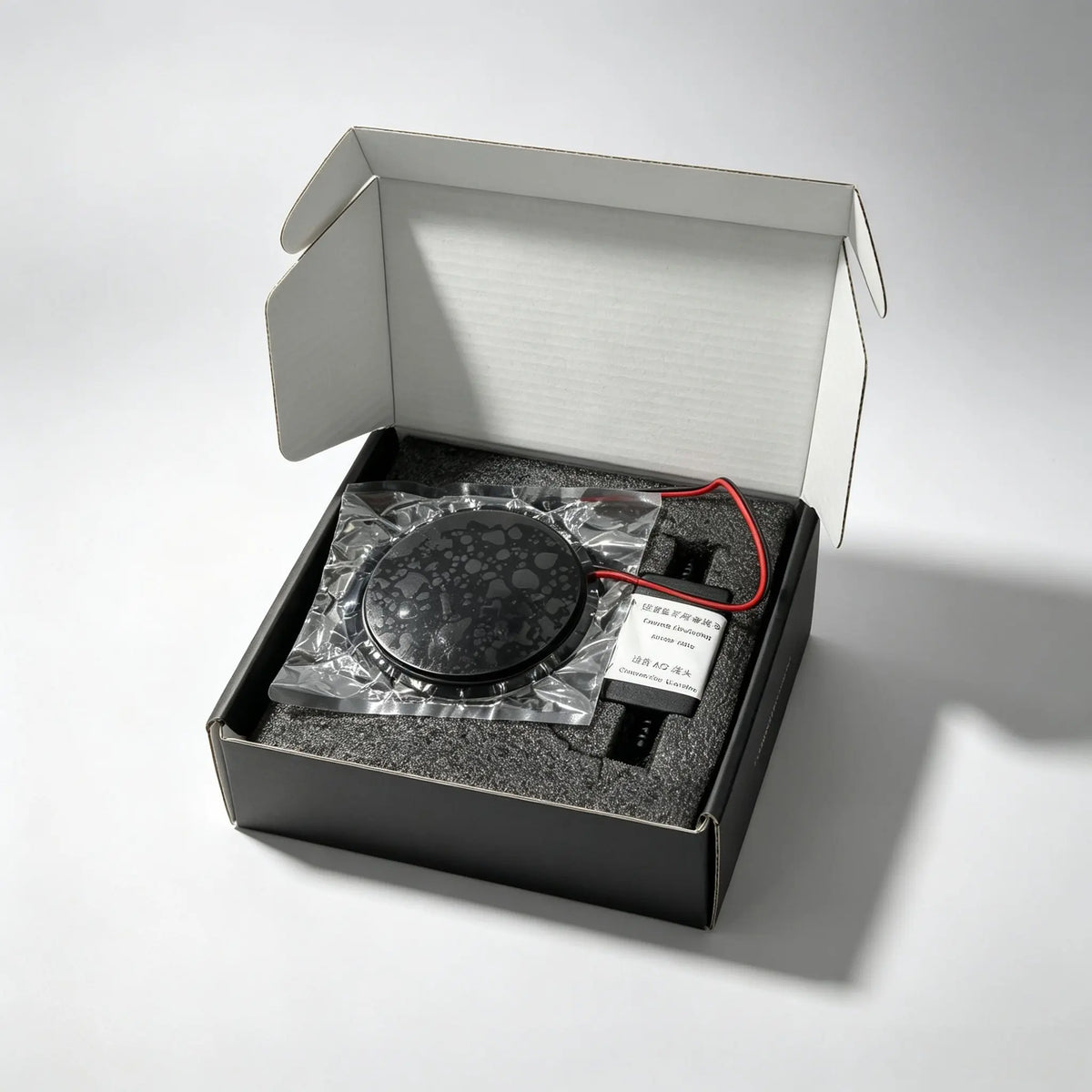 BMW animated LED emblem package contents - display badge, circuit board and manual