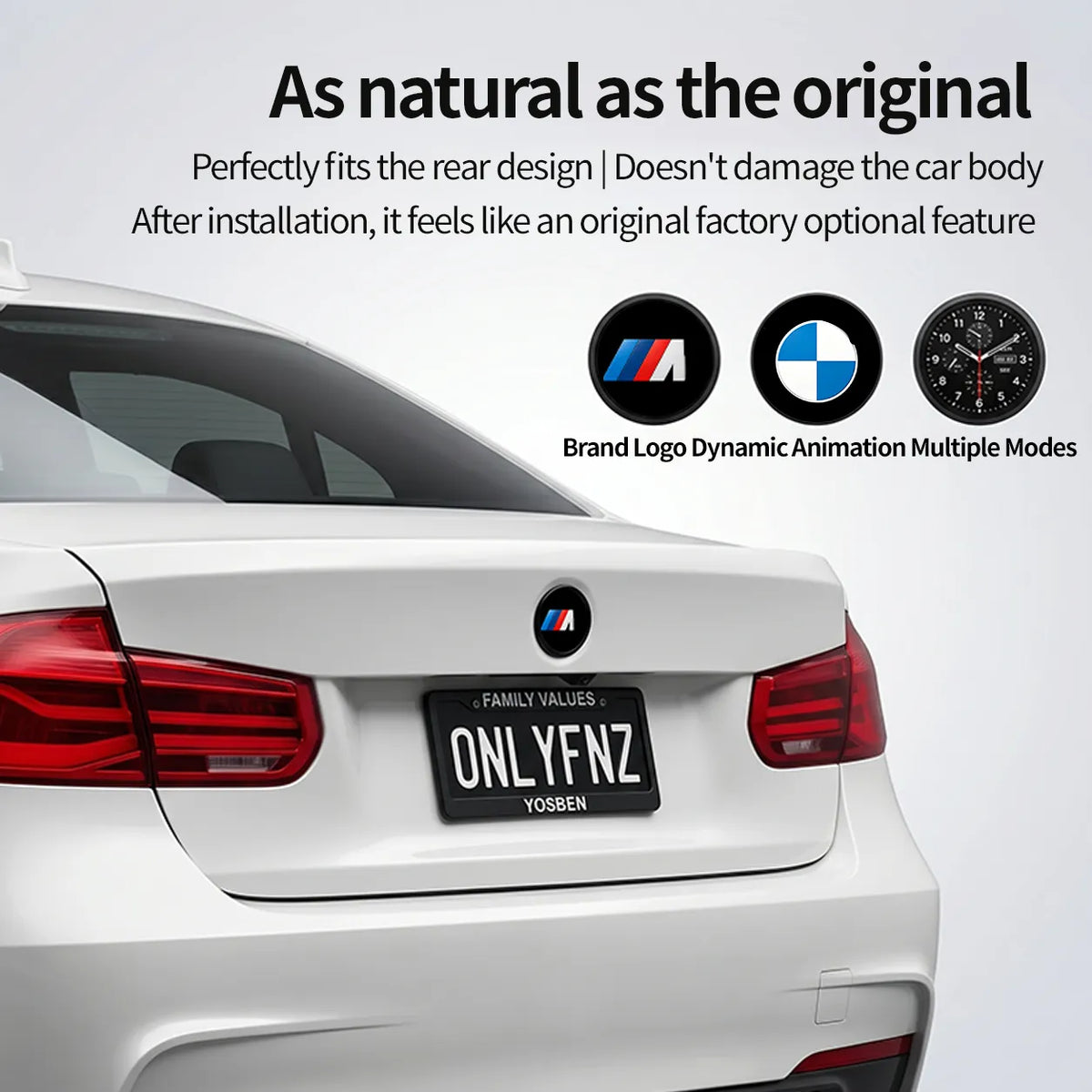 BMW digital display emblem badge installed on the rear of a white BMW 3 Series showing the M logo